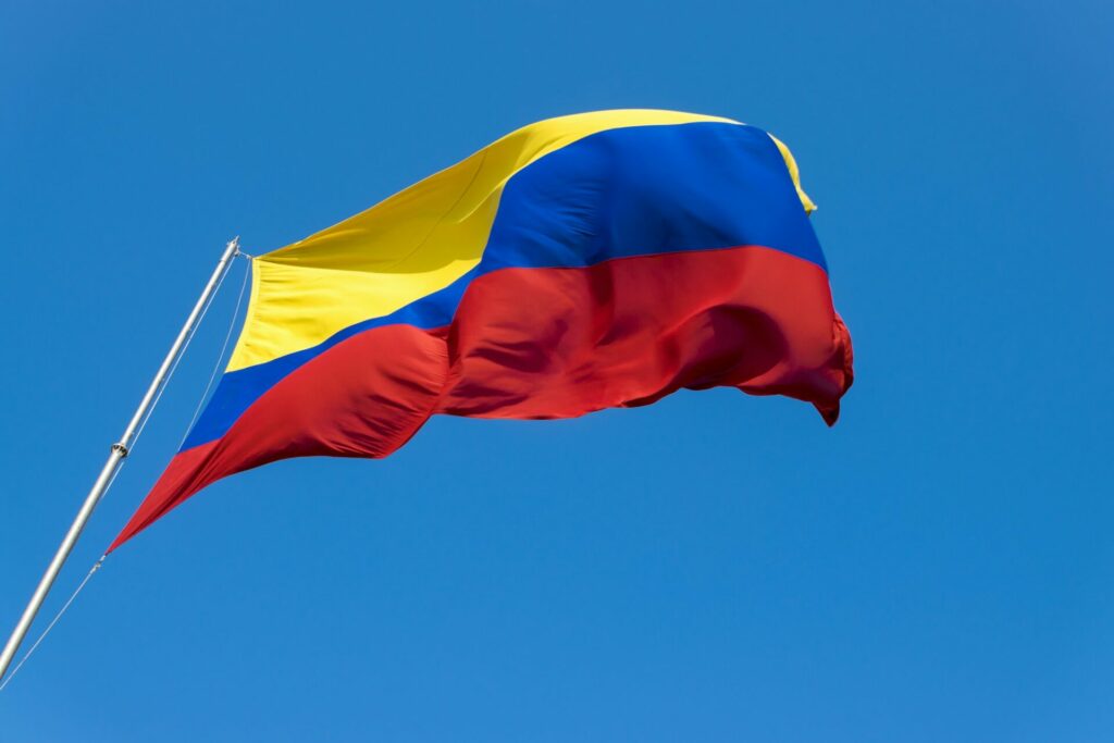 A Colombian flag is streaming in the wind.